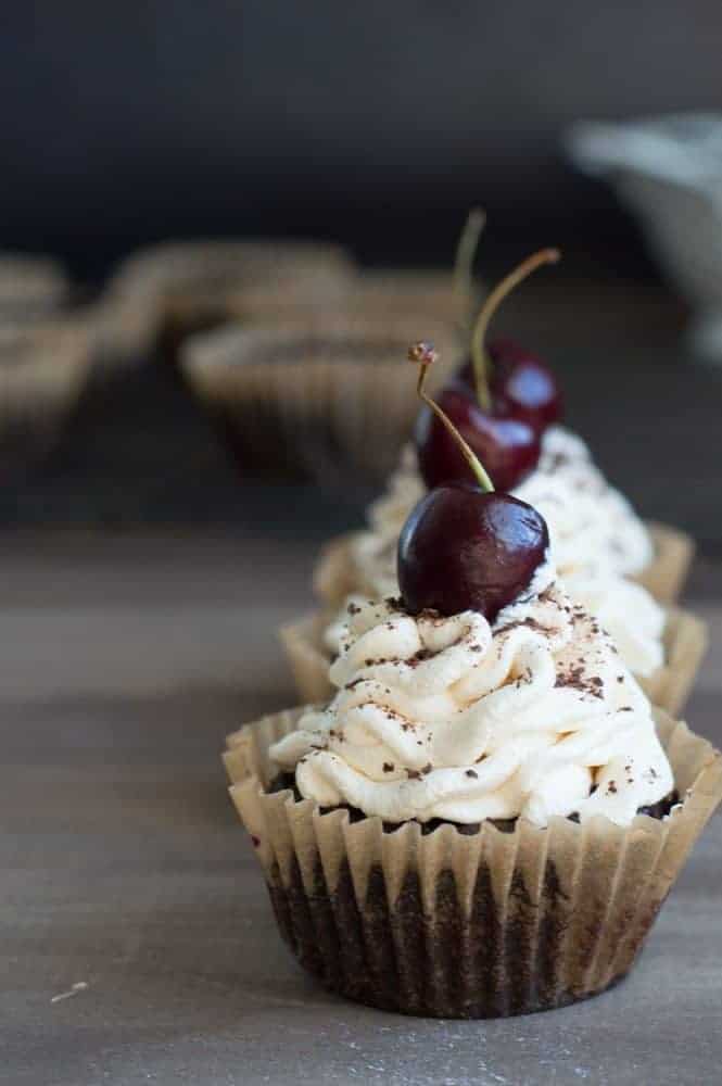 black forest cupcakes on a wooden board