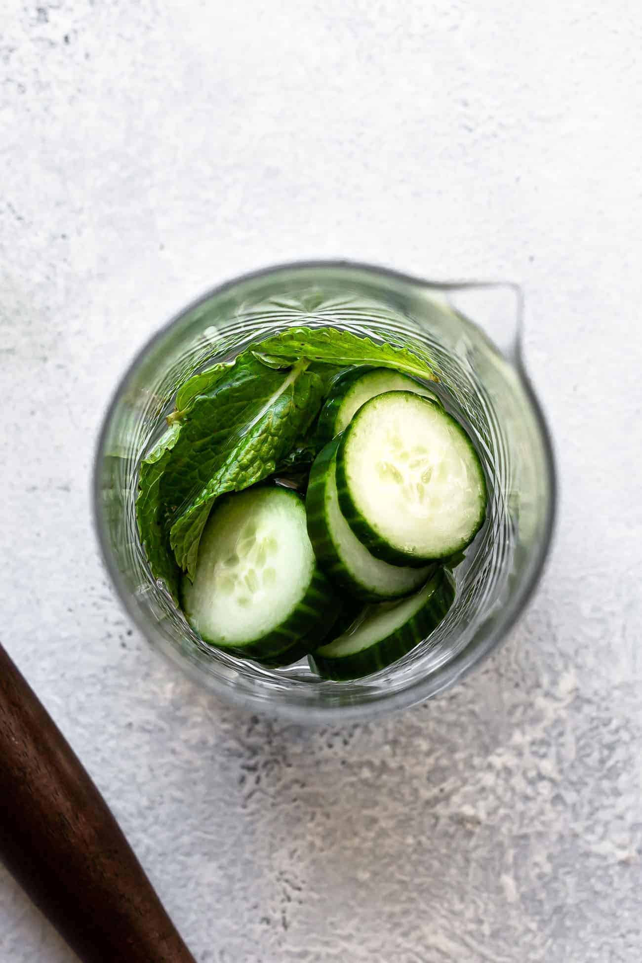 cucumber, mint and simple syrup in a glass jar